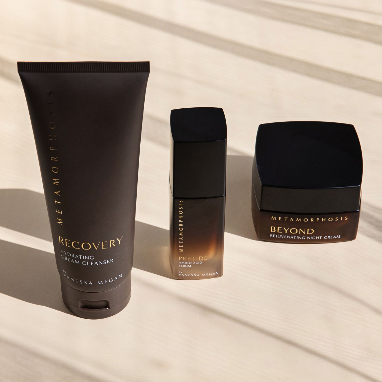 Metamorphosis nighttime skincare ritual featuring Recovery Hydrating Cream Cleanser, Peptide Amino Acid Serum, and Beyond Rejuvenating Night Cream for peri to post-menopausal skin.