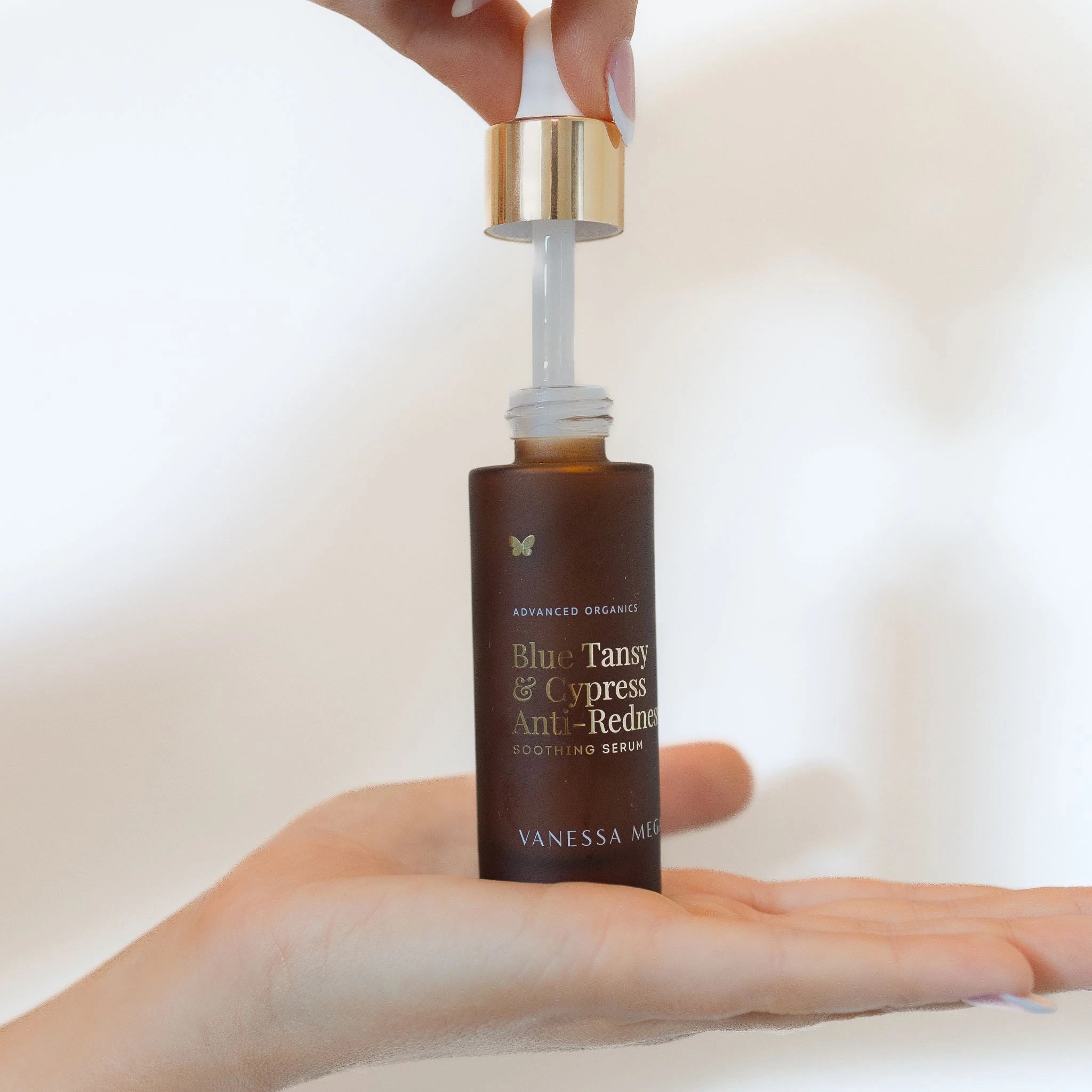 Vanessa Megan Blue Tansy and Cypress Anti-Redness Serum in hand — natural serum for sensitive skin, formulated with blue tansy, cypress, and organic botanicals.