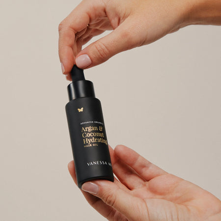 Hand holding Vanessa Megan Argan & Coconut Hydrating Hair Oil – 100% natural, nutrient-rich argan oil treatment for smooth, frizz-free, healthy hair NZ