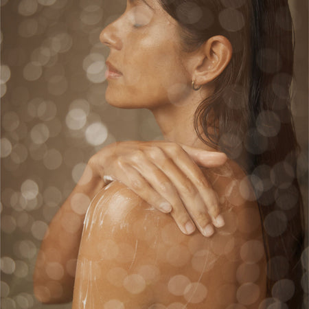 Woman in shower applying Vanessa Megan natural body wash, available to shop at Intentionally Natural NZ.