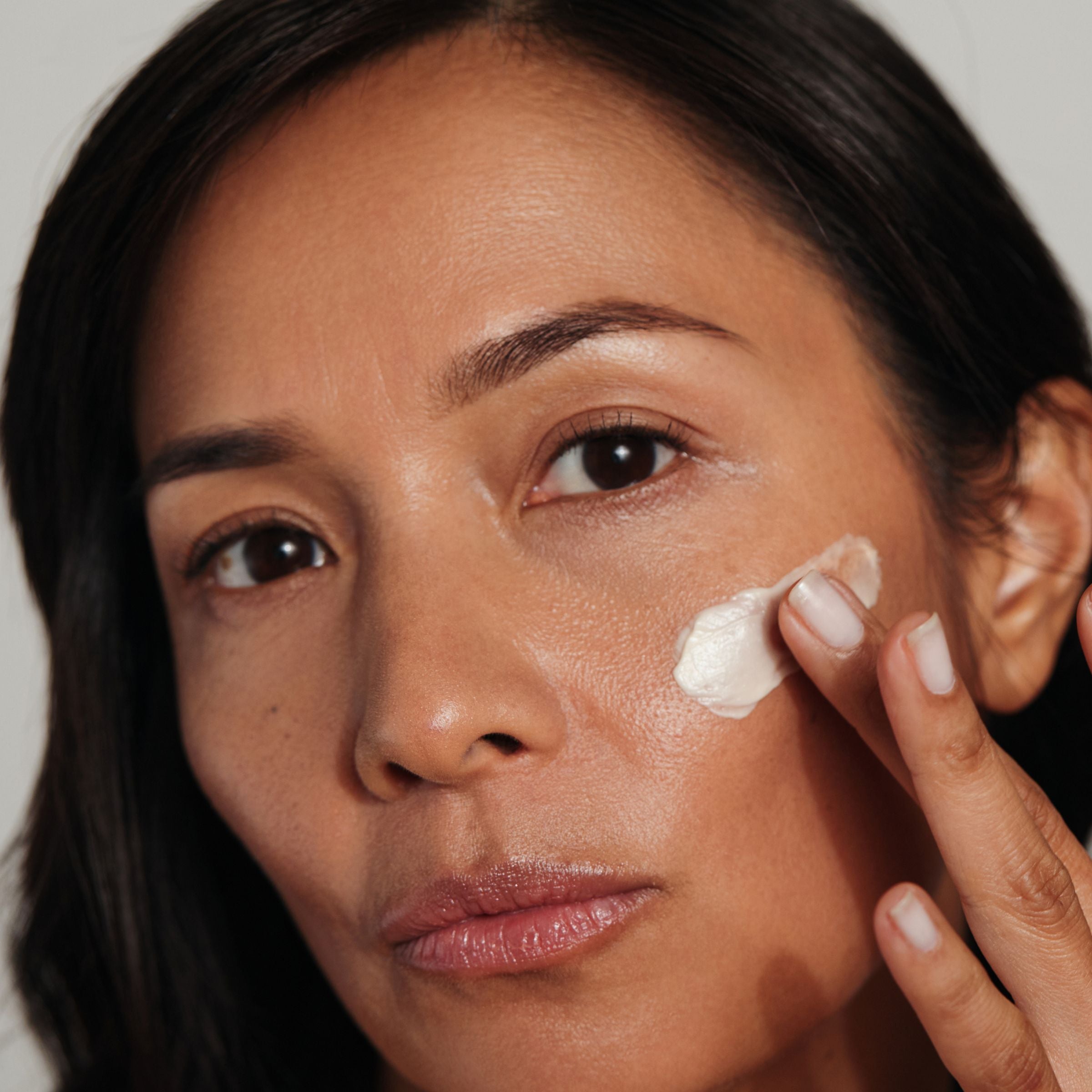 Women holding The Metamorphosis Emerge Face cream for menopausal skin