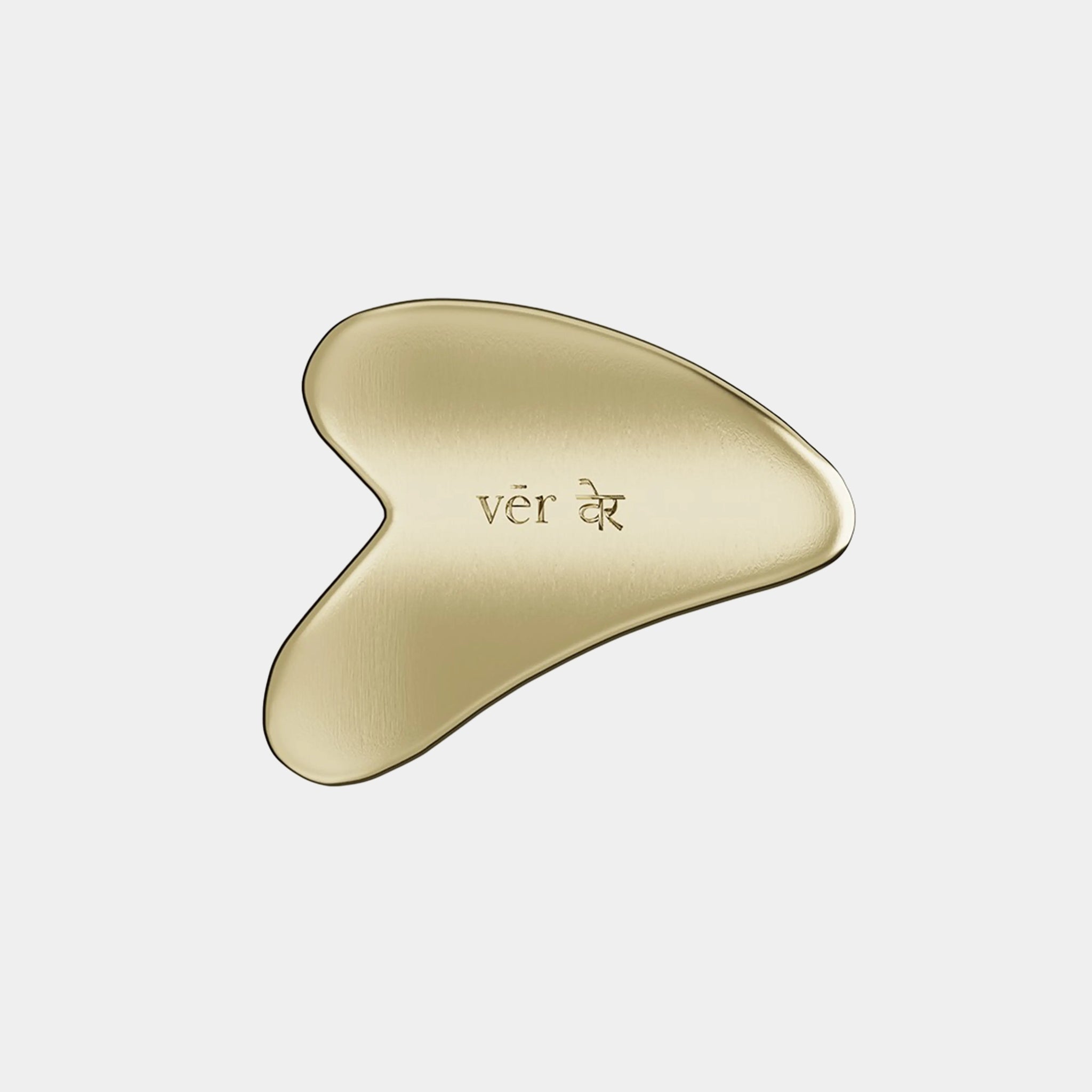 Vēr the Ritual Kansa Gua Sha tool made from traditional Kansa metal, shaped for facial massage and Ayurvedic skincare rituals.
