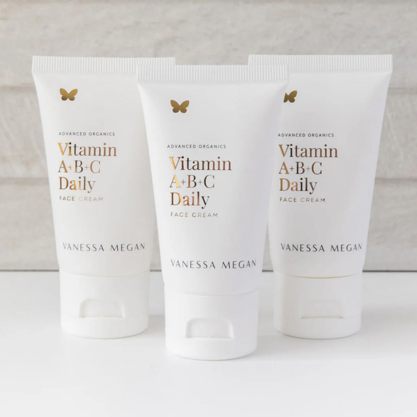 Three tubes of Vanessa Megan Vitamin A+B+C Daily Face Cream displayed together, natural vitamin-rich moisturiser for radiant and hydrated skin.