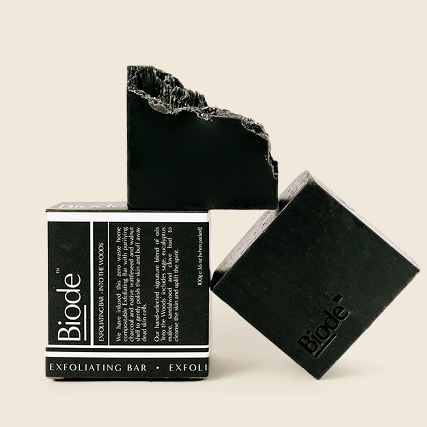 Biode Exfoliating Bar Into the Woods charcoal soap and compostable box for deep natural cleansing.