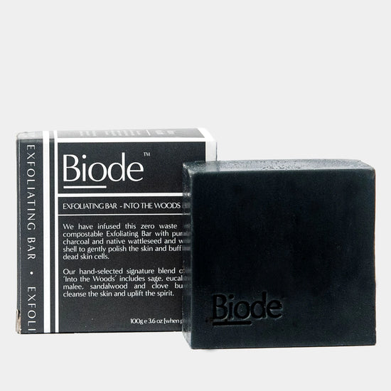 Biode Exfoliating Bar Into the Woods with charcoal soap and black home compostable box packaging.