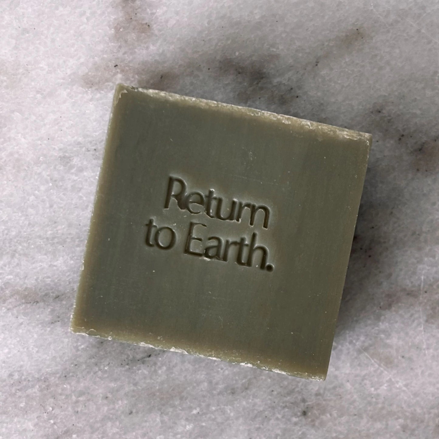 Biode 100% natural  Into the Ocean hand and body wash bar on marble surface.