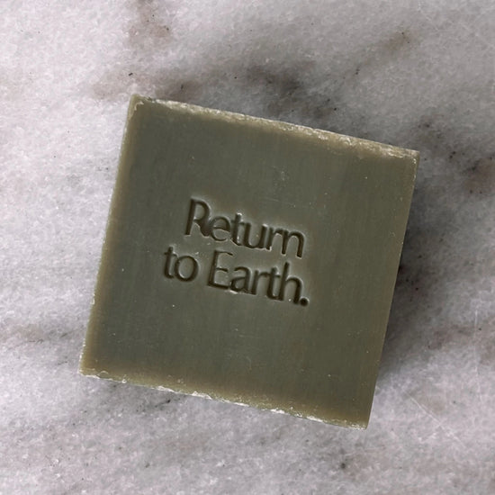 Biode 100% natural  Into the Ocean hand and body wash bar on marble surface.