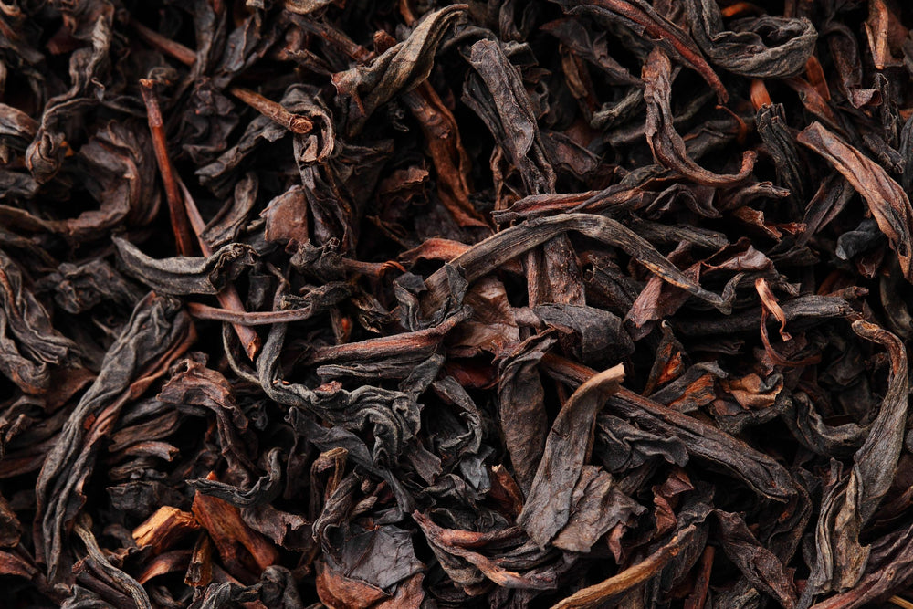 Close up of organic dried black tea leaves used in loose leaf tea blends and natural wellness products.