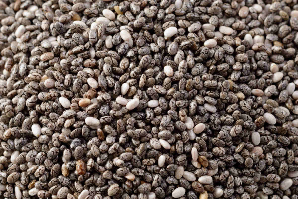 A close-up pile of organic chia seeds filling the entire frame.