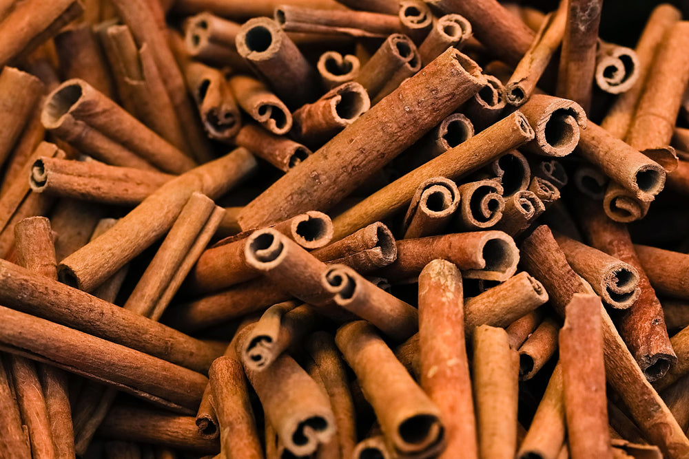 Close up of whole cinnamon sticks used in herbal tea blends wellness products and natural beauty formulations.