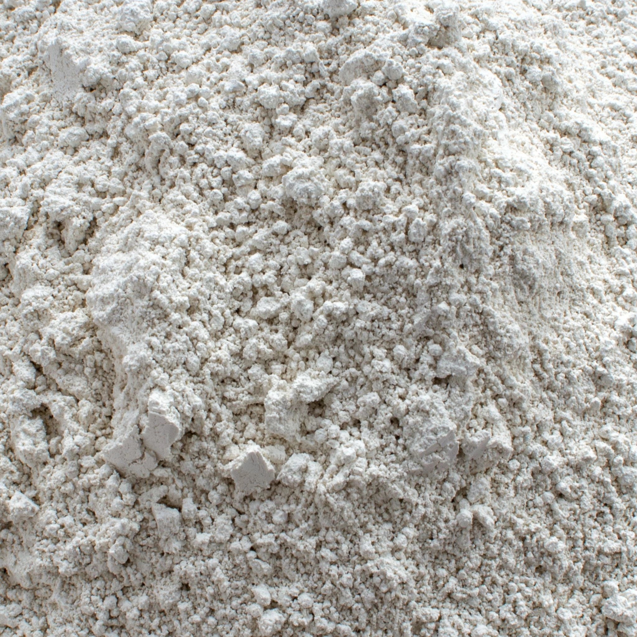 Close-up of natural diatomaceous earth powder, a fine, off-white mineral-rich ingredient used in natural deodorants and skincare for its absorbent and detoxifying properties.