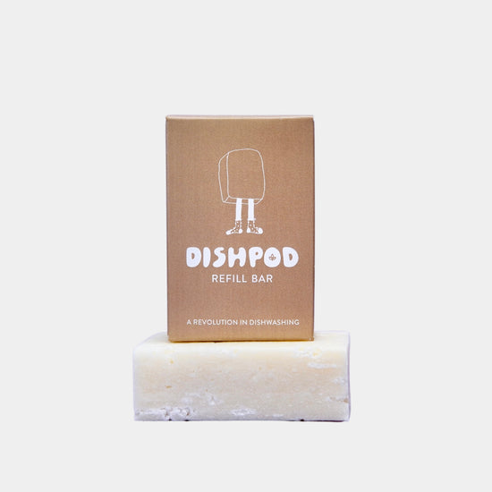 Dishpod refill bar box on top of unboxed solid Dispod dish wash detergent bar