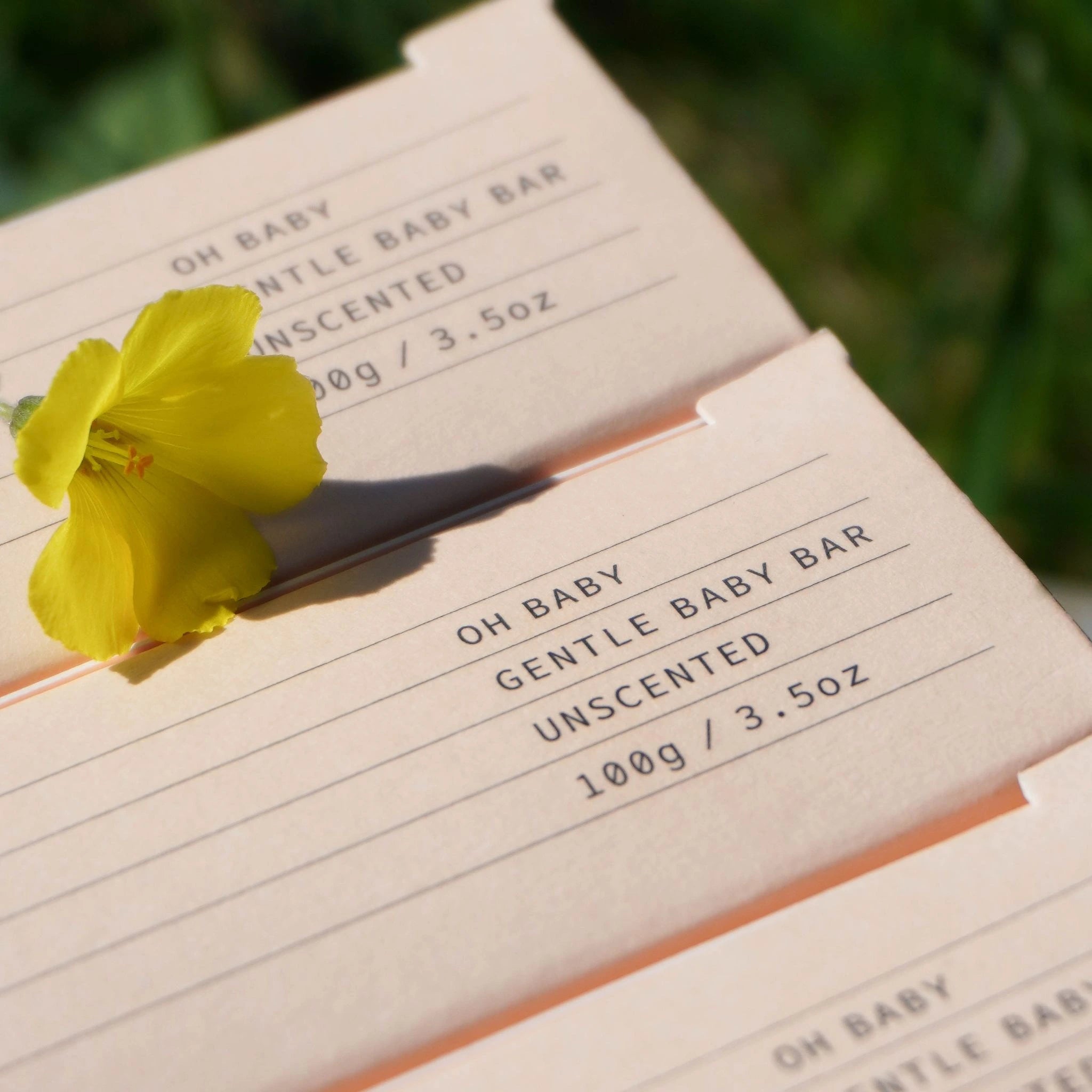 Fair + Square Oh Baby Gentle Baby Bar in eco-packaging with a yellow flower, 100g unscented natural soap for delicate newborn and sensitive skin care in NZ.
