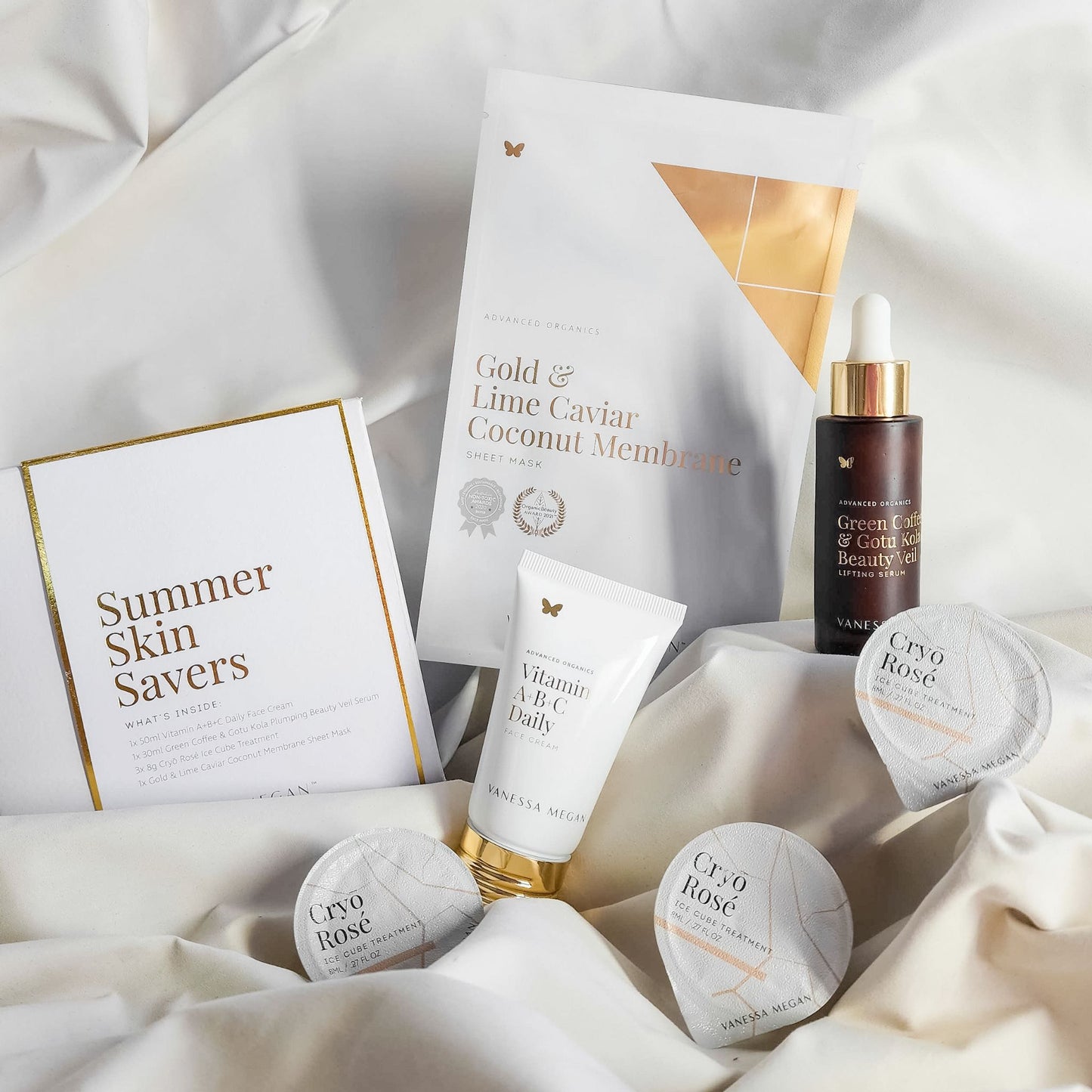 Vanessa Megan Summer Skin Savers skincare collection featuring Vitamin A+B+C Daily Face Cream, Green Coffee & Gotu Kola Beauty Veil Serum, Cryo Rosé Ice Cube Treatment and Gold & Lime Caviar Coconut Membrane Sheet Mask.