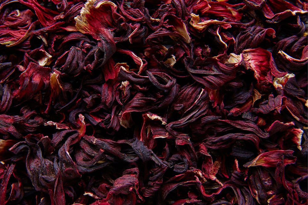 Dried hibiscus flower petals rich in natural antioxidants used in herbal infusions health and wellness teas and natural botanical beauty products.
