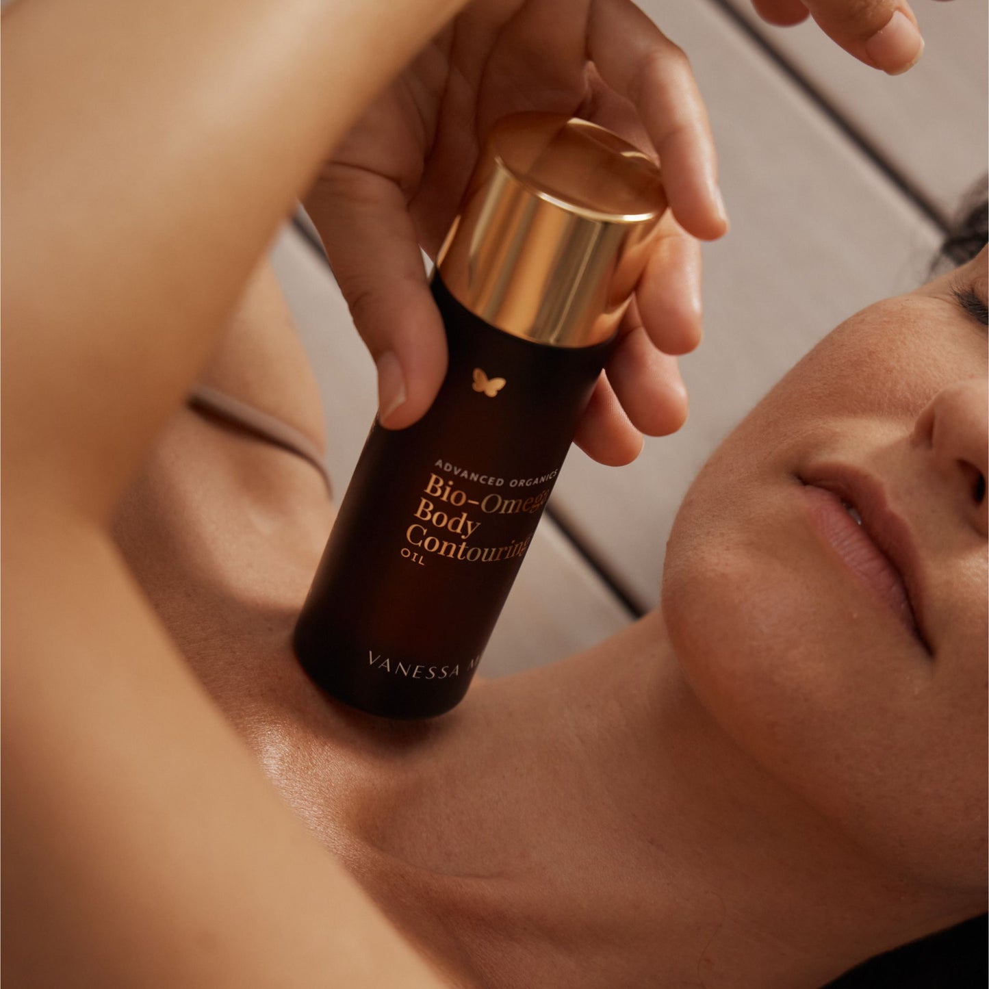 Vanessa Megan Bio Omega Body Contouring Oil applied to neck and décolletage, natural omega rich firming body oil for improving skin elasticity tone and hydration, luxury organic body treatment in New Zealand .