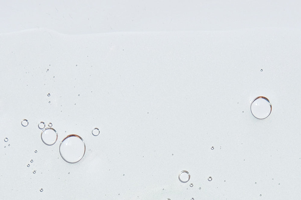 Macro texture shot representing L-Arginine – a collagen-boosting amino acid known to strengthen the skin barrier and enhance hydration in natural skincare.