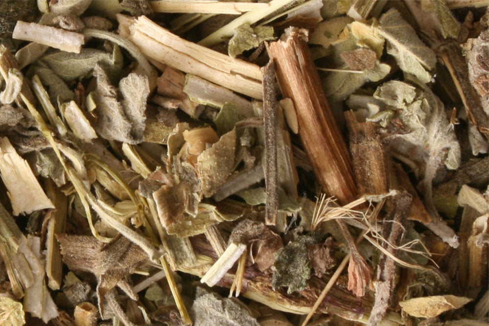 Close up of dried lemon balm leaves used in herbal tea wellness skincare and natural beauty formulations.
