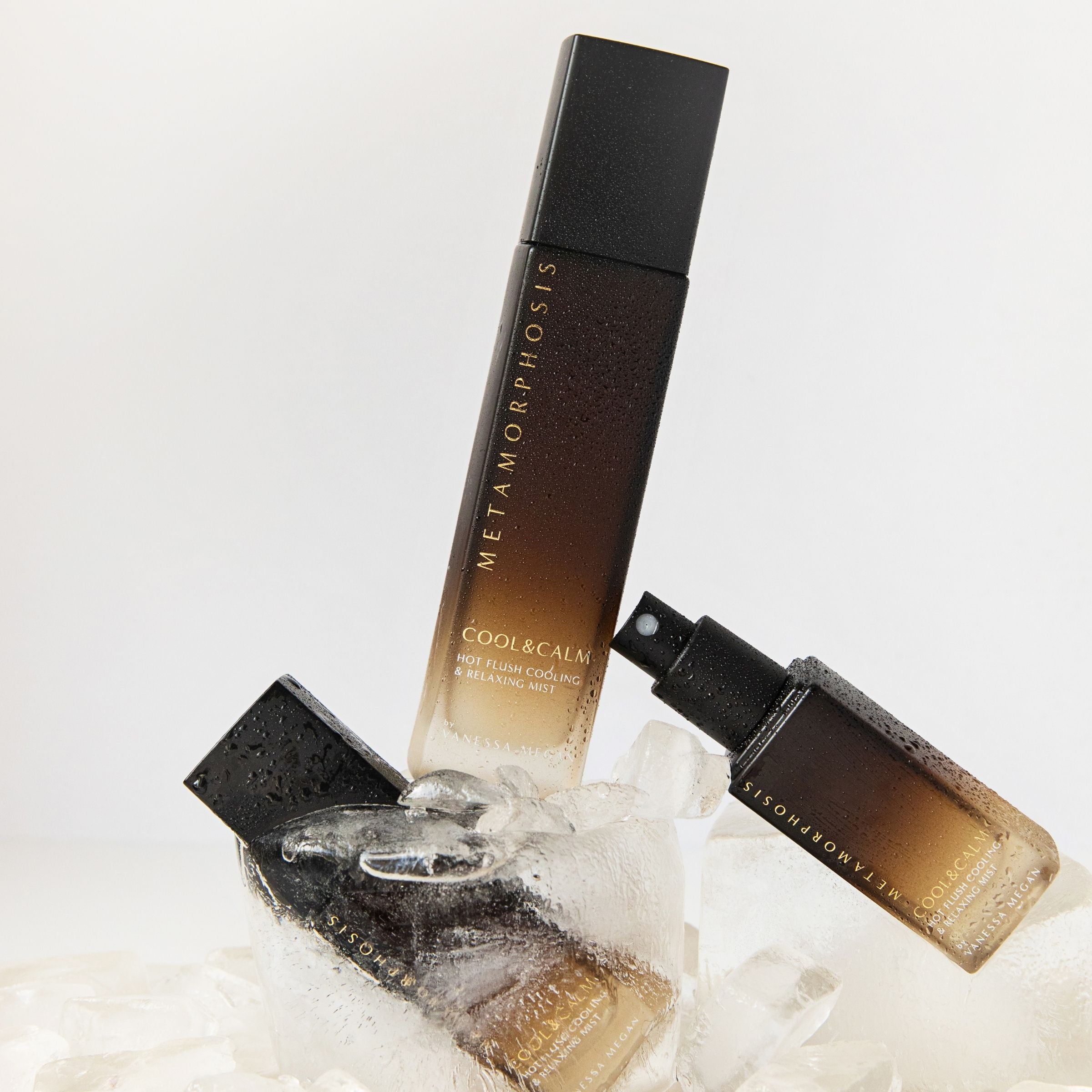 Metamorphosis Cool and Calm Mist, a refreshing hot flush and stress relief spray bottle nestled in ice.