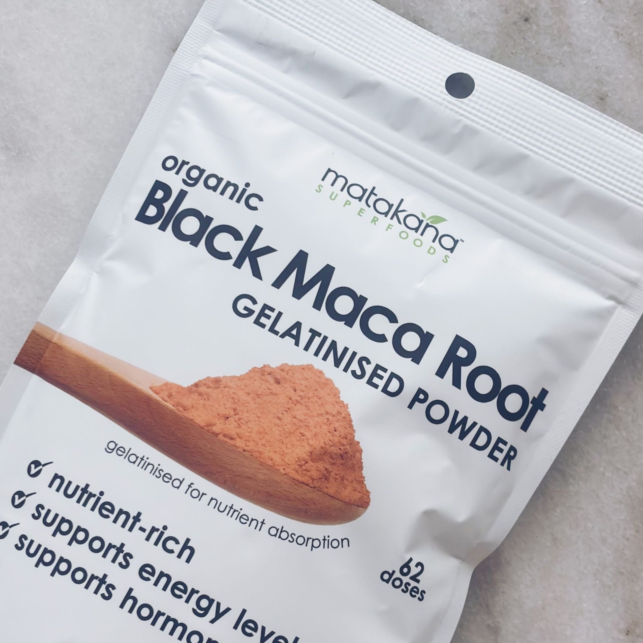 Matakana Superfoods Black Maca Root Gelatinised Powder pouch on marble bench .