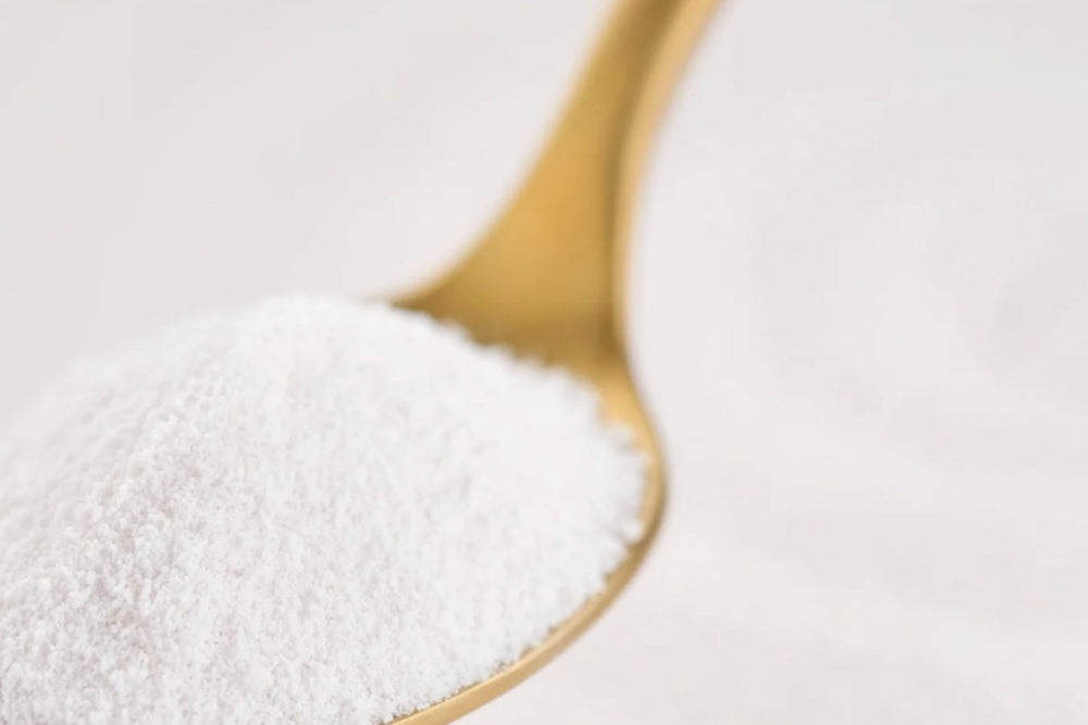 Larger spoonful  of the Matakana Superfoods Premium Marine Collagen Peptide Powder on gold spoon.