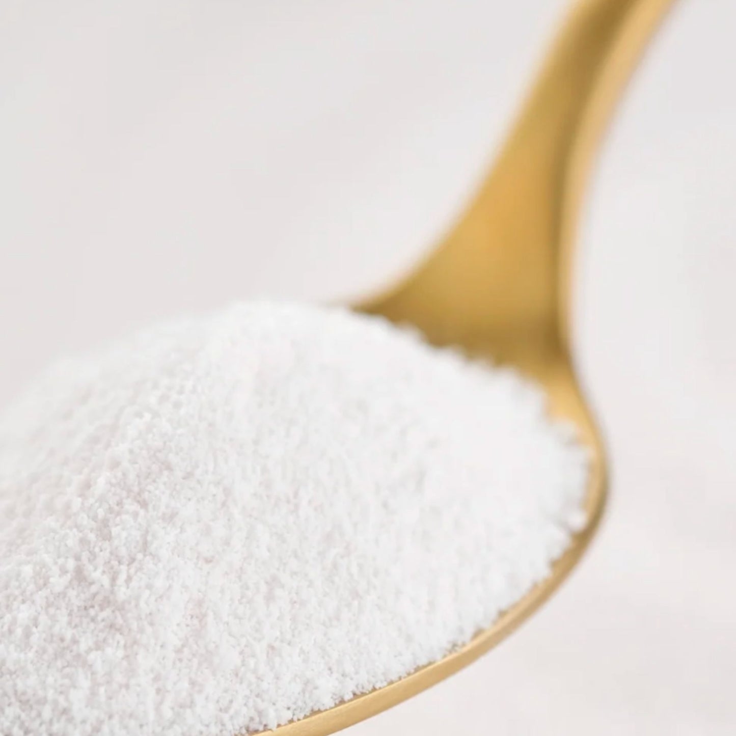1 serve of Matakana Superfoods Premium Marine Collagen Peptide Powder on gold spoon.