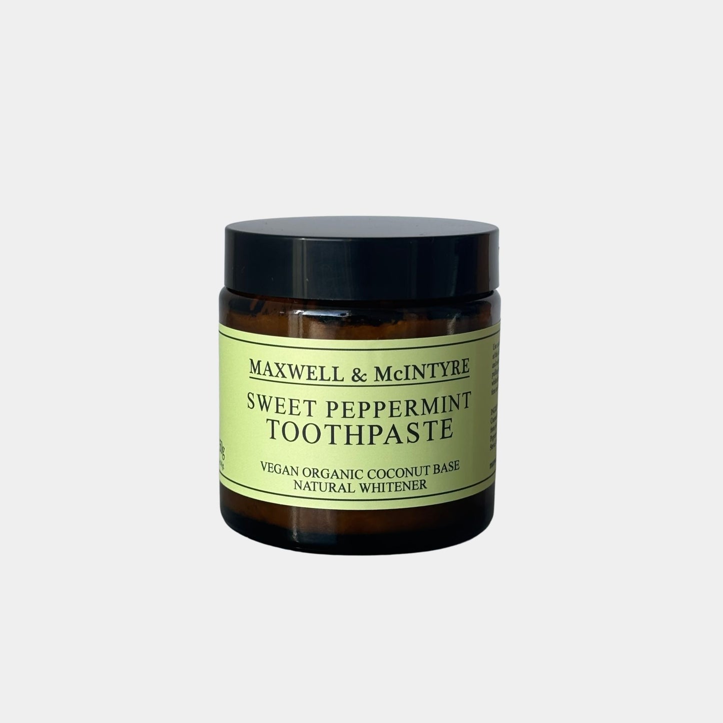Maxwell & McIntyre Sweet Peppermint Toothpaste in amber glass jar with black lid.