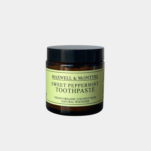 Maxwell & McIntyre Sweet Peppermint Toothpaste in amber glass jar with black lid.