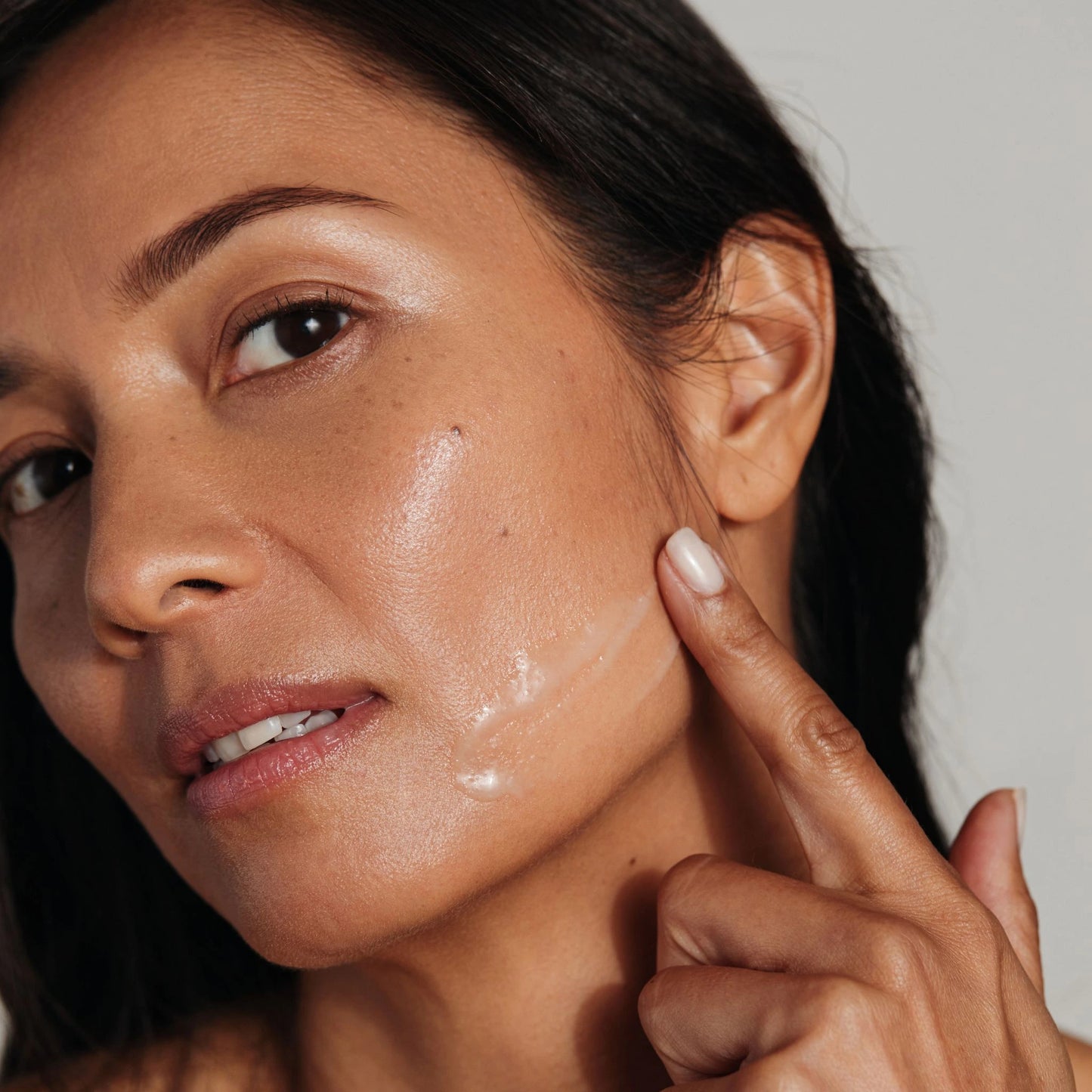 Metamorphosis Chrysalis Vital Collagen and Hydration Serum being applied to the face