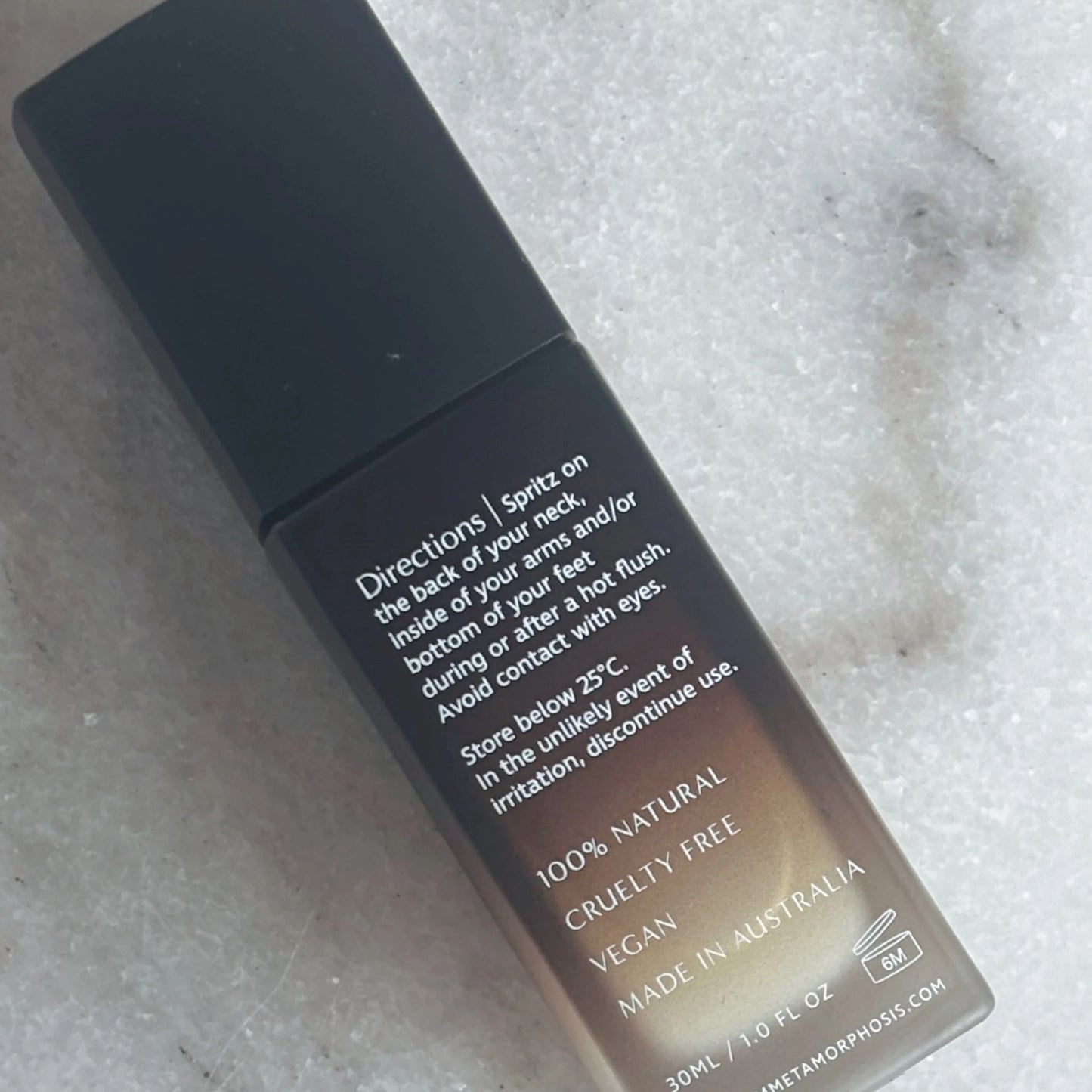 Back of Metamorphosis Cool & Calm Mist bottle showing usage directions and formulation details including vegan, cruelty-free, and made in Australia.
