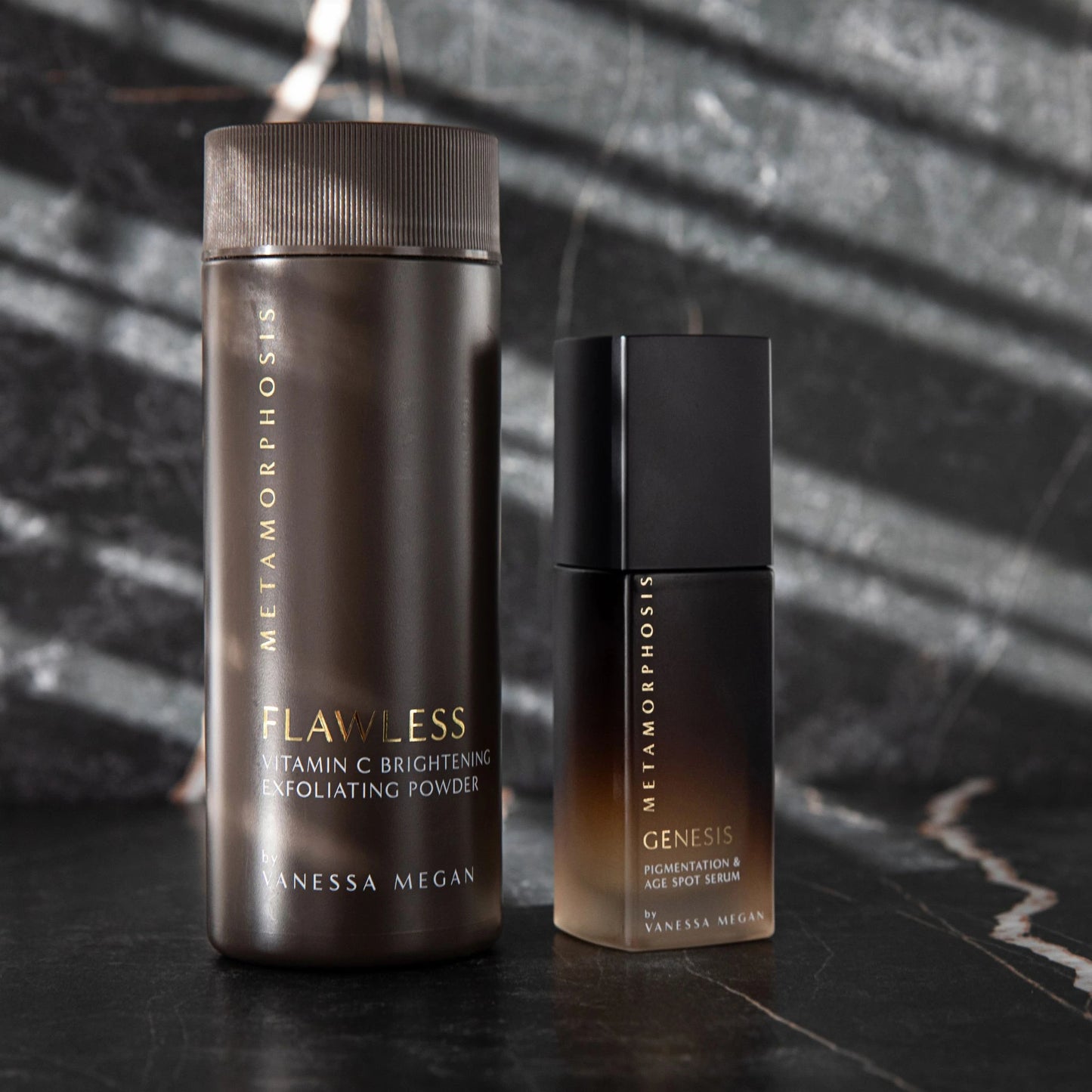 The Flawless Exfoliating Powder pictured next to the Metamorphosis Genesis Serum
