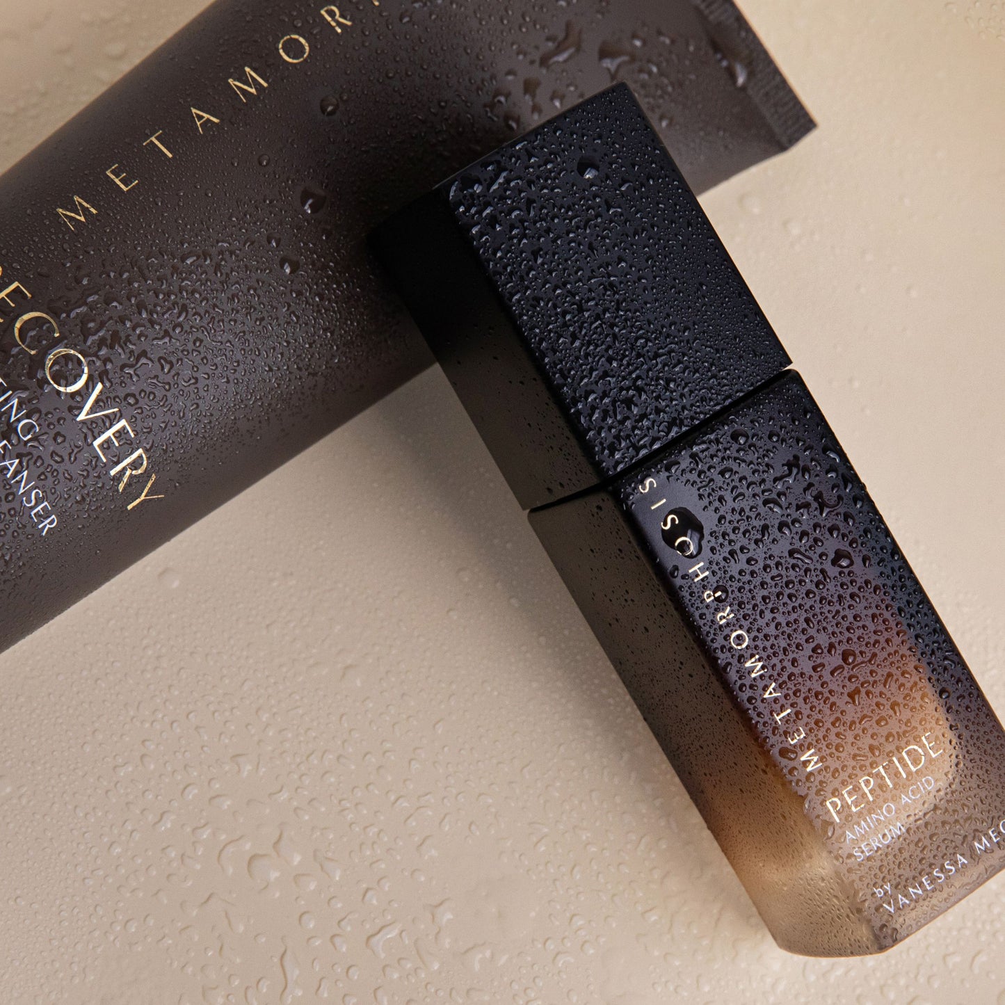 Close-up of Metamorphosis Recovery Hydrating Cream Cleanser and Peptide Amino Acid Serum