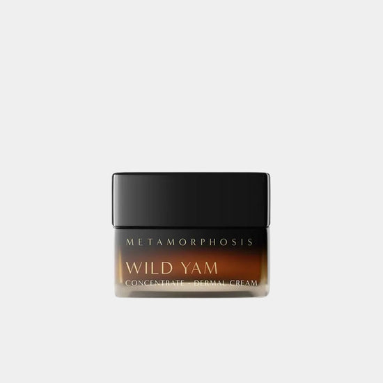 A jar of Metamorphosis Wild Yam Concentrate Daily Cream with a black lid and a dark amber-brown glass body at Intentionally Natural NZ.