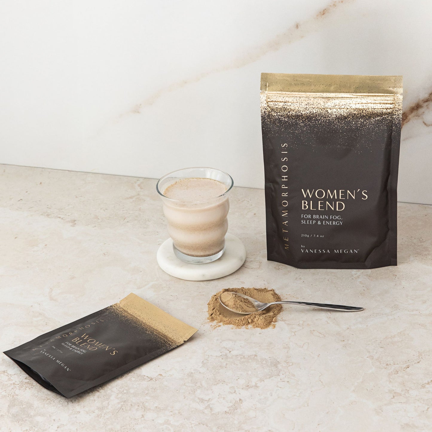Vanessa Megan Women’s Blend pouch styled on a swirl of powdered supplement – supporting sleep, energy, and cognitive clarity for women in menopause.