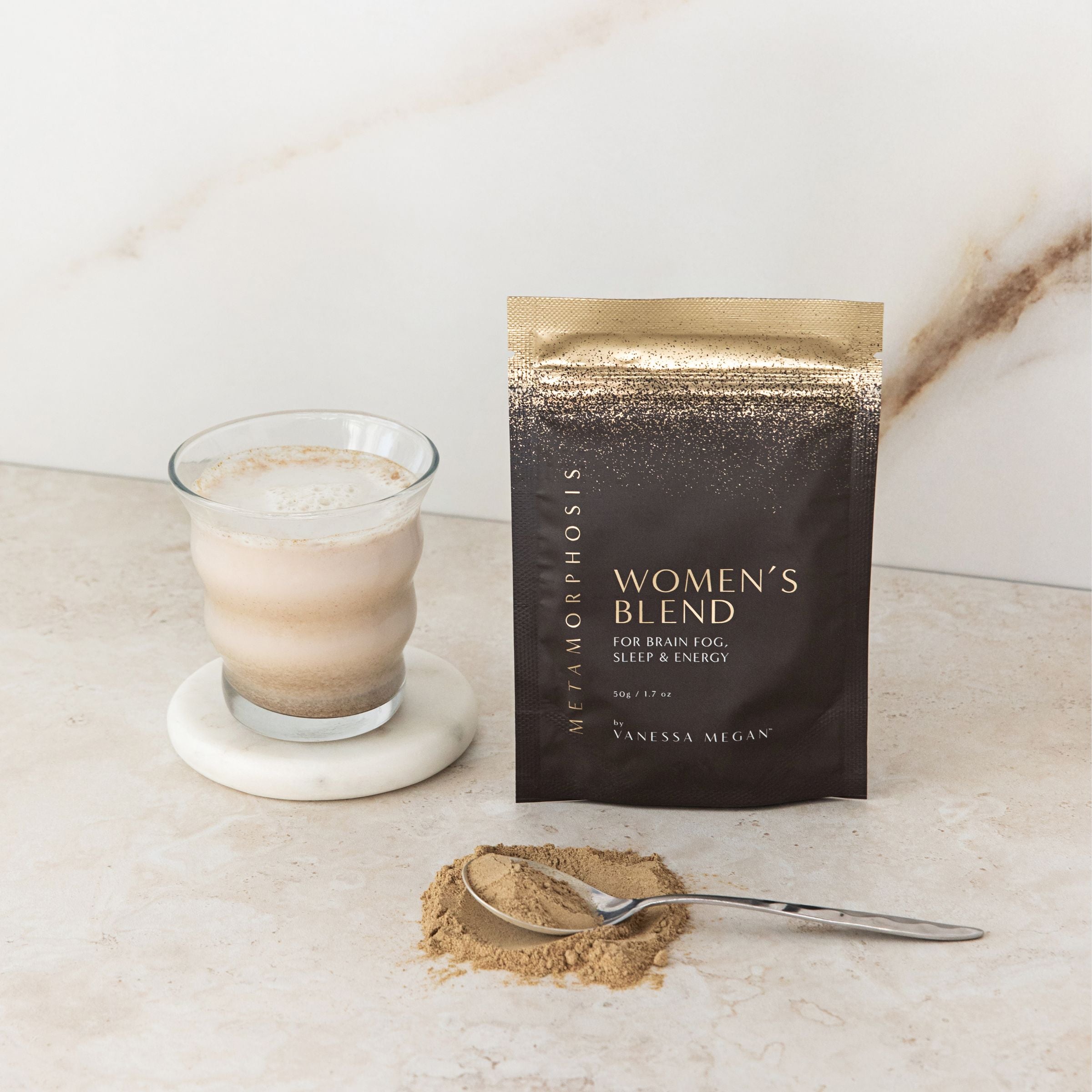 Metamorphosis Women’s Blend in 50g pouch, styled with a prepared drink and powder scoop – formulated for brain, sleep, and energy support during menopause.