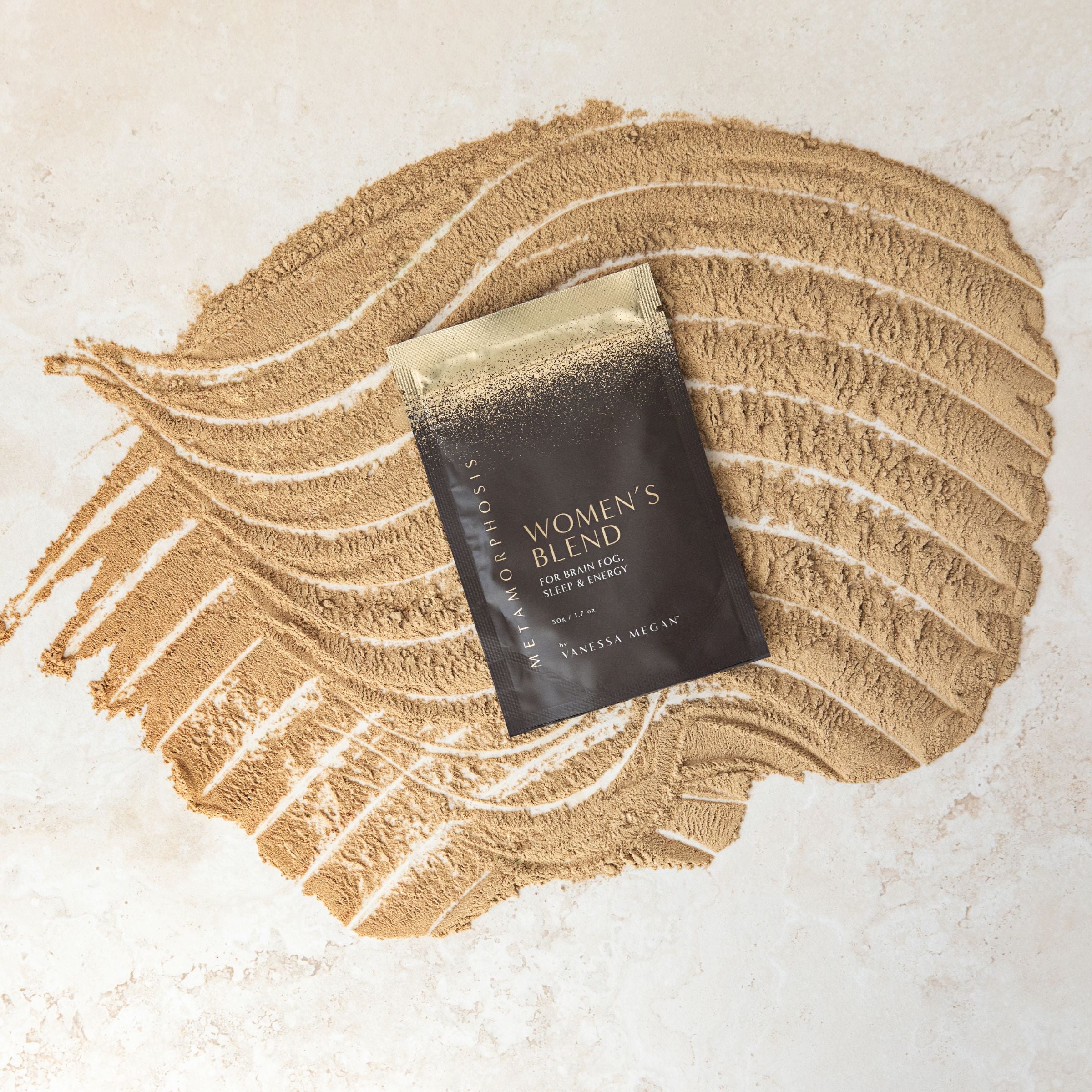 Metamorphosis Women’s Blend pouch styled on a swirl of powdered supplement – supporting sleep, energy, and cognitive clarity for women in menopause.