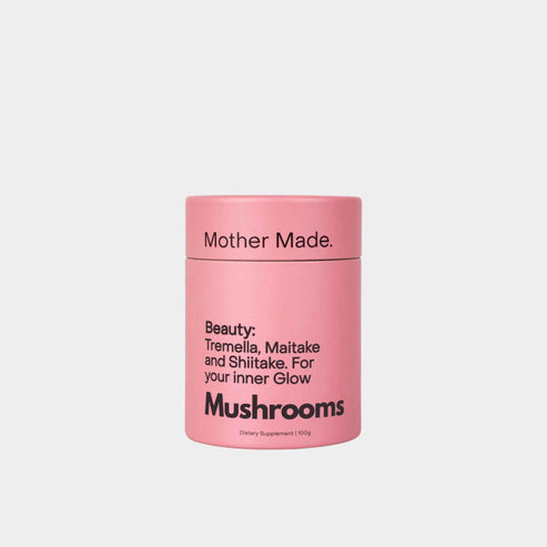 A pink cylindrical container of Mother Made. Beauty: Tremella, Maitake and Shiitake Powder.