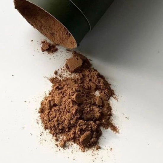 Mother Made AM blend powder with Lion’s Mane, Cordyceps and Chaga spilled from its BPA free green packaging at Intentionally Natural NZ