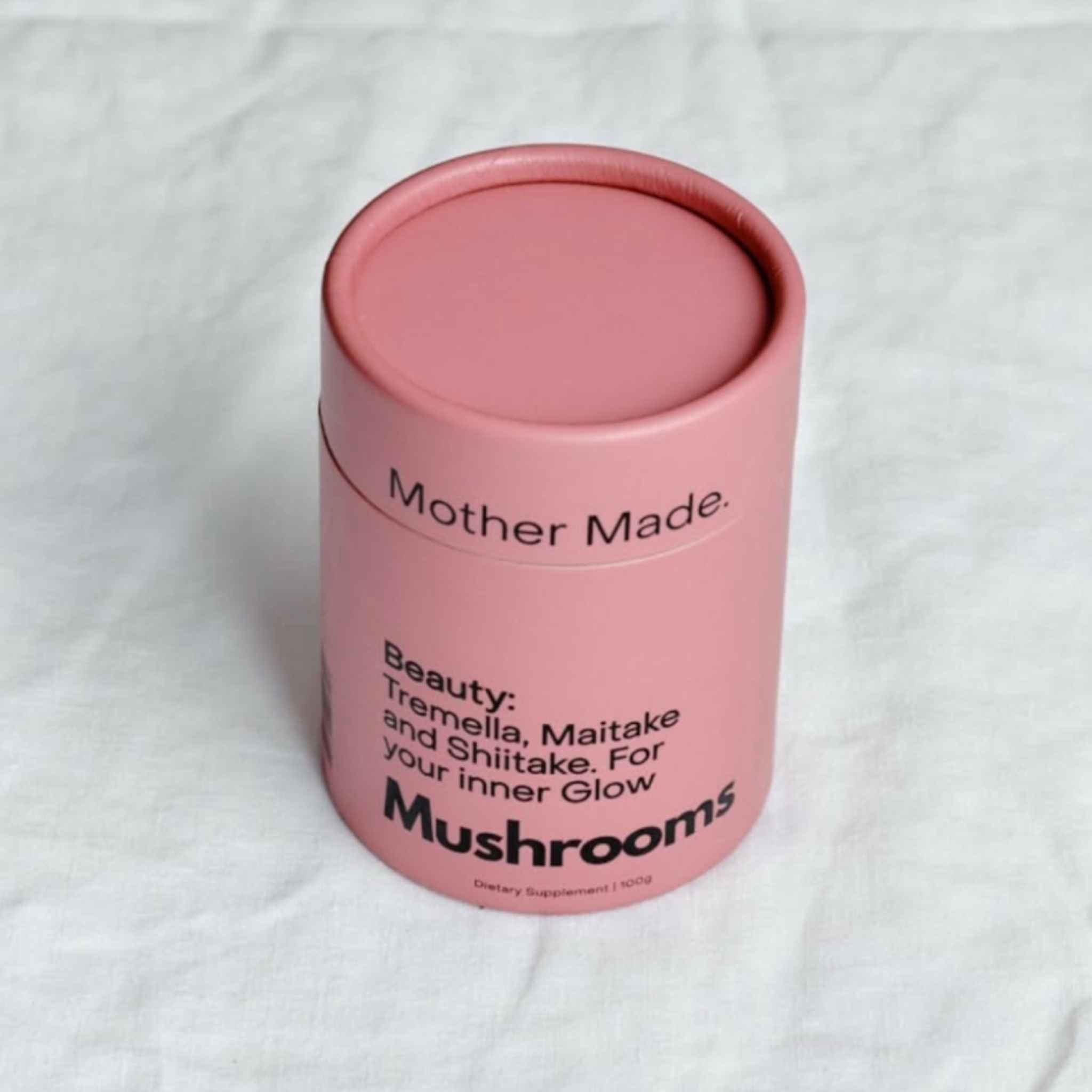 A pink cylindrical tin of 'Mother Made. Beauty: Tremella, Maitake and Shiitake.