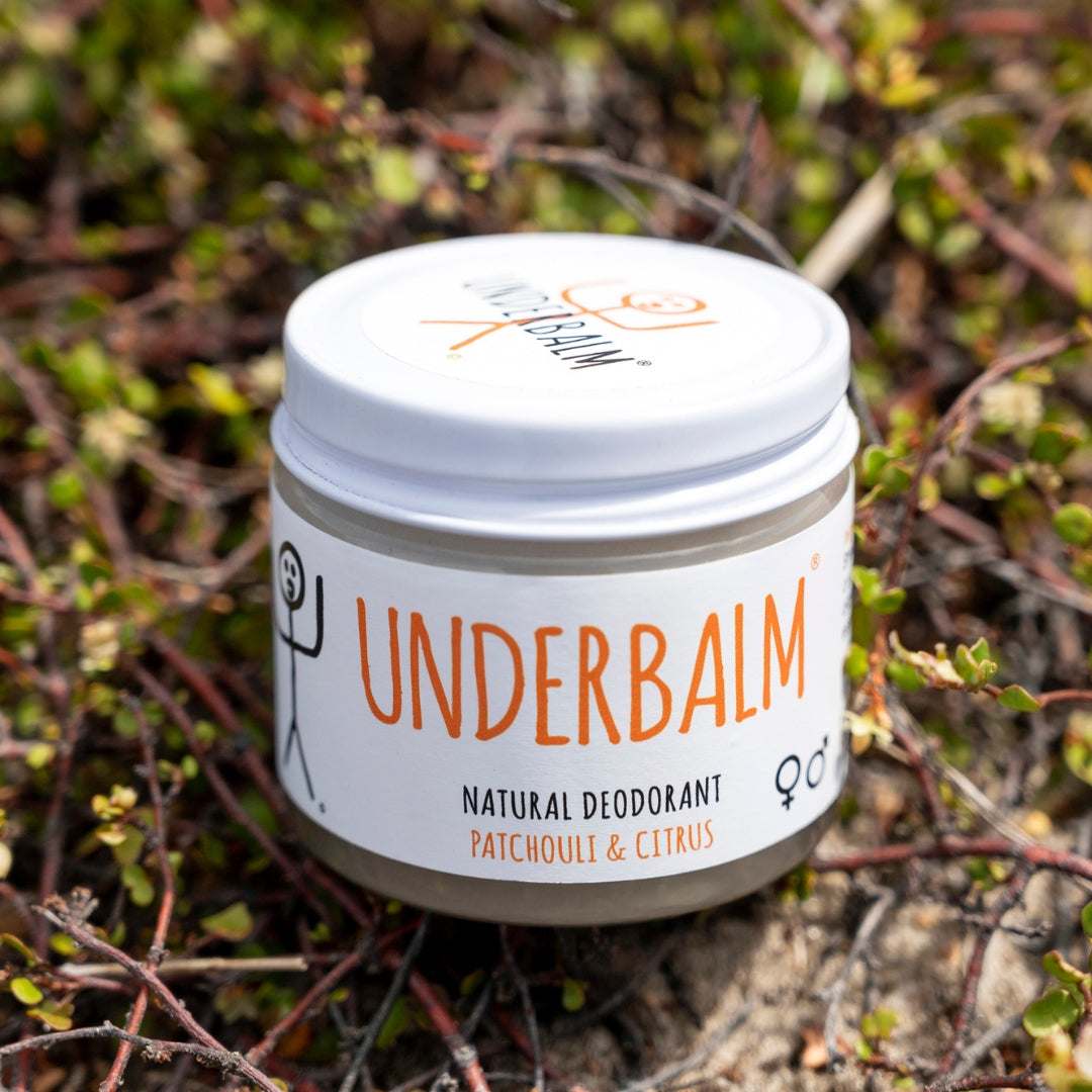 No3 Underbalm Patchouli and Citrus natural deodorant jar photographed outdoors on native greenery.