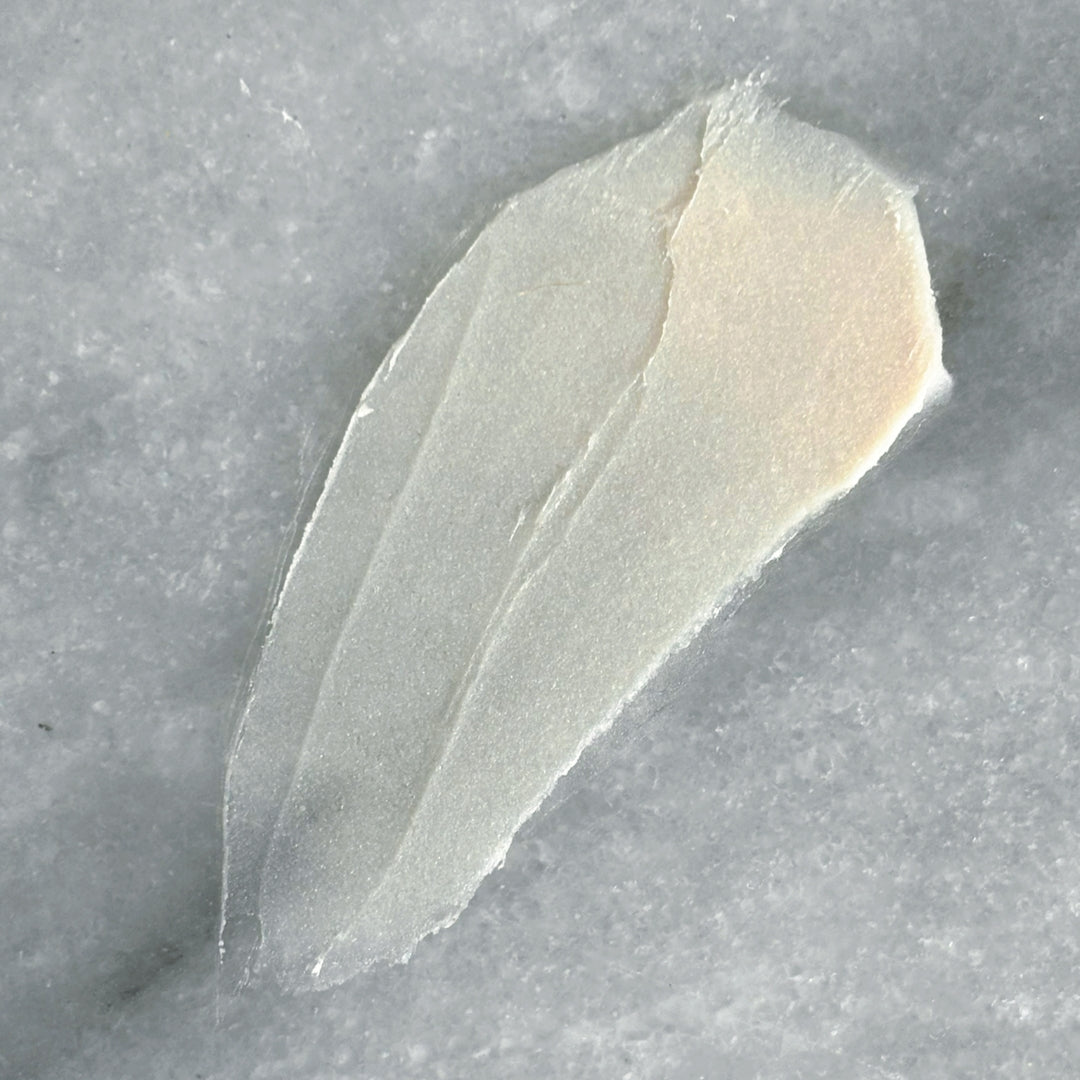  Swatch of No3 Underbalm natural deodorant paste on a marble surface, showing smooth, spreadable consistency.