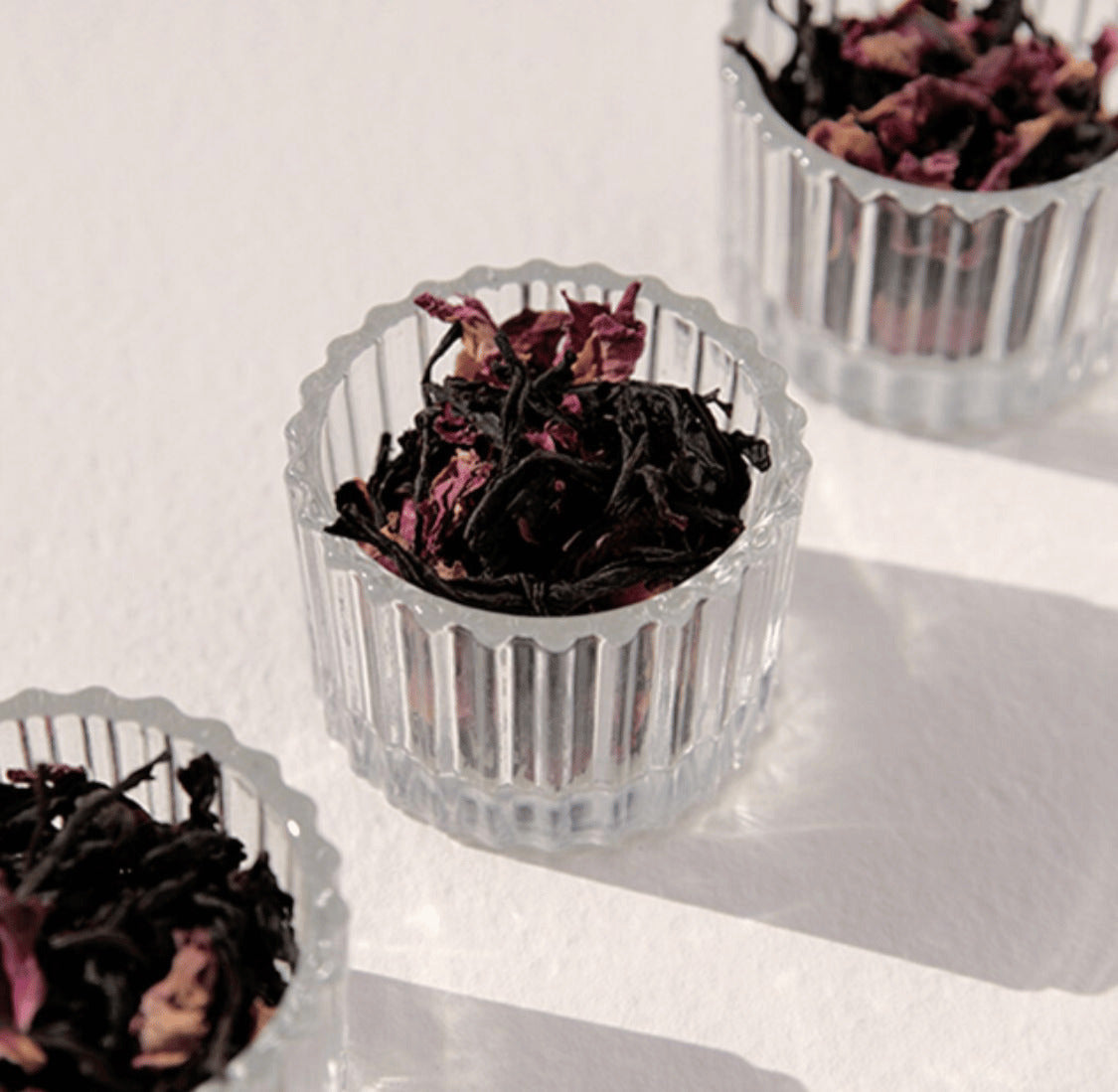 On Sundays Earl Grey loose leaf tea blend styled in glass bowls highlighting whole leaf black tea and botanicals.