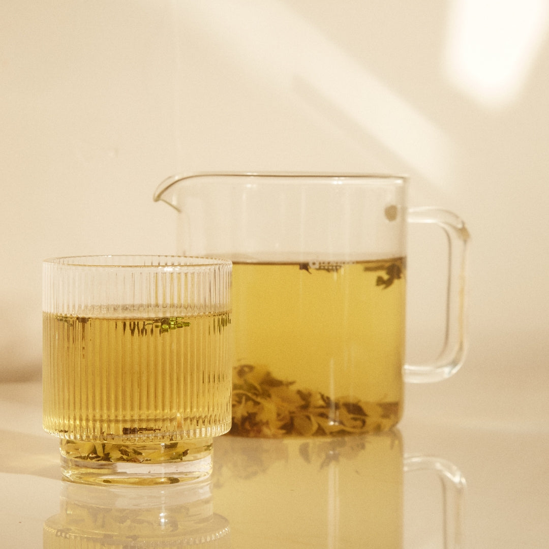 On Sundays Ease tea in glass and jug