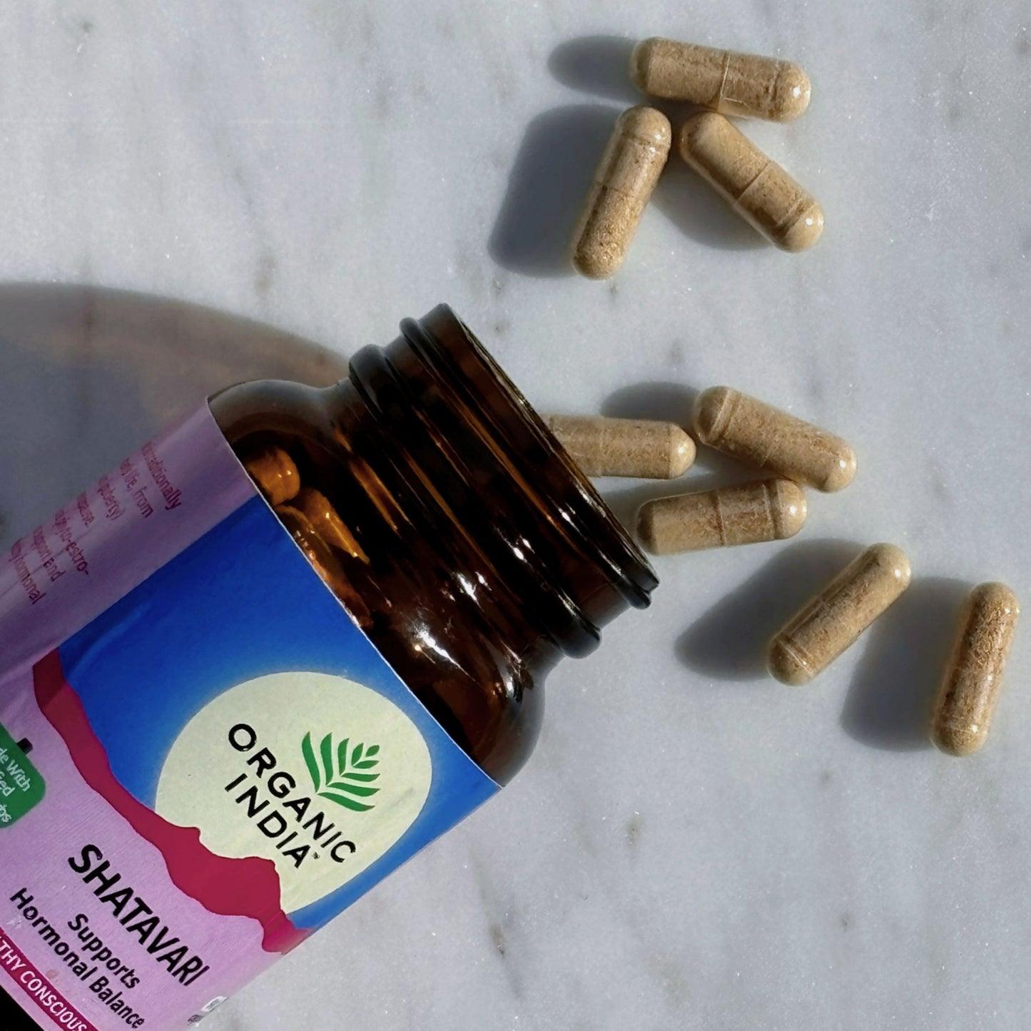 Organic India Shatavari capsules for hormonal balance – styled on marble and photographed at Intentionally Natural NZ