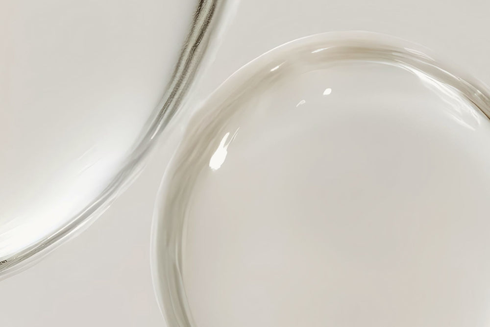 Clear liquid representing pea and soy peptides – natural skincare actives used in cosmetic formulations to boost collagen, strengthen the skin barrier, and reduce wrinkles and dullness.