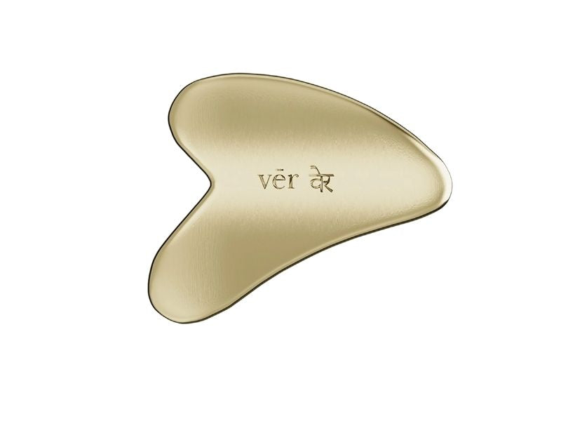 vēr वेर Kansa Gua Sha tool made from smooth golden Kansa metal for natural facial massage and skin rejuvenation