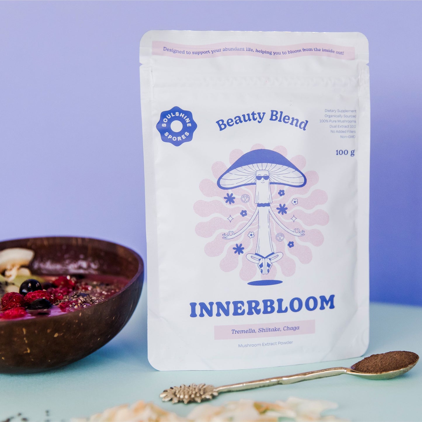 Soulshine Spores InnerBloom Beauty Blend with berry smoothie bowl and spoon – beauty-boosting mushroom extract powder for daily glow and nourishment