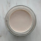 Top-down view of No3 Underbalm natural deodorant paste inside the jar, showcasing its smooth, creamy texture.