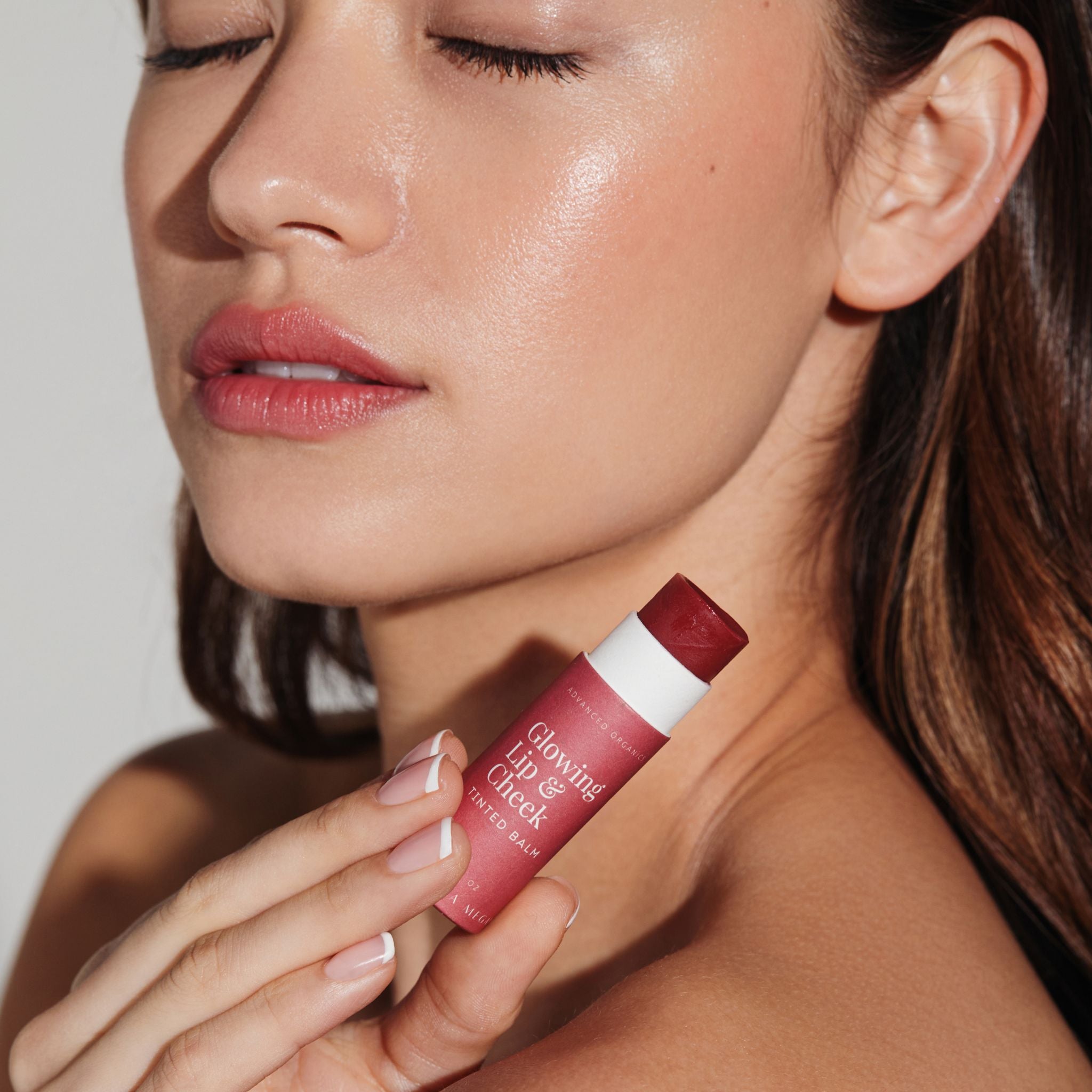 Women  wearing the Vanessa Megan Glowing Lip and Cheek Tinted Balm applied to lips and cheeks, clean organic makeup delivering a sheer radiant buildable flush of natural colour.