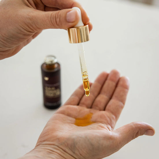 Vanessa Megan N.E.O. 12 Hour Miracle Oil – nutrient-rich, organic facial oil being dispensed from a dropper for deep hydration and skin rejuvenation.